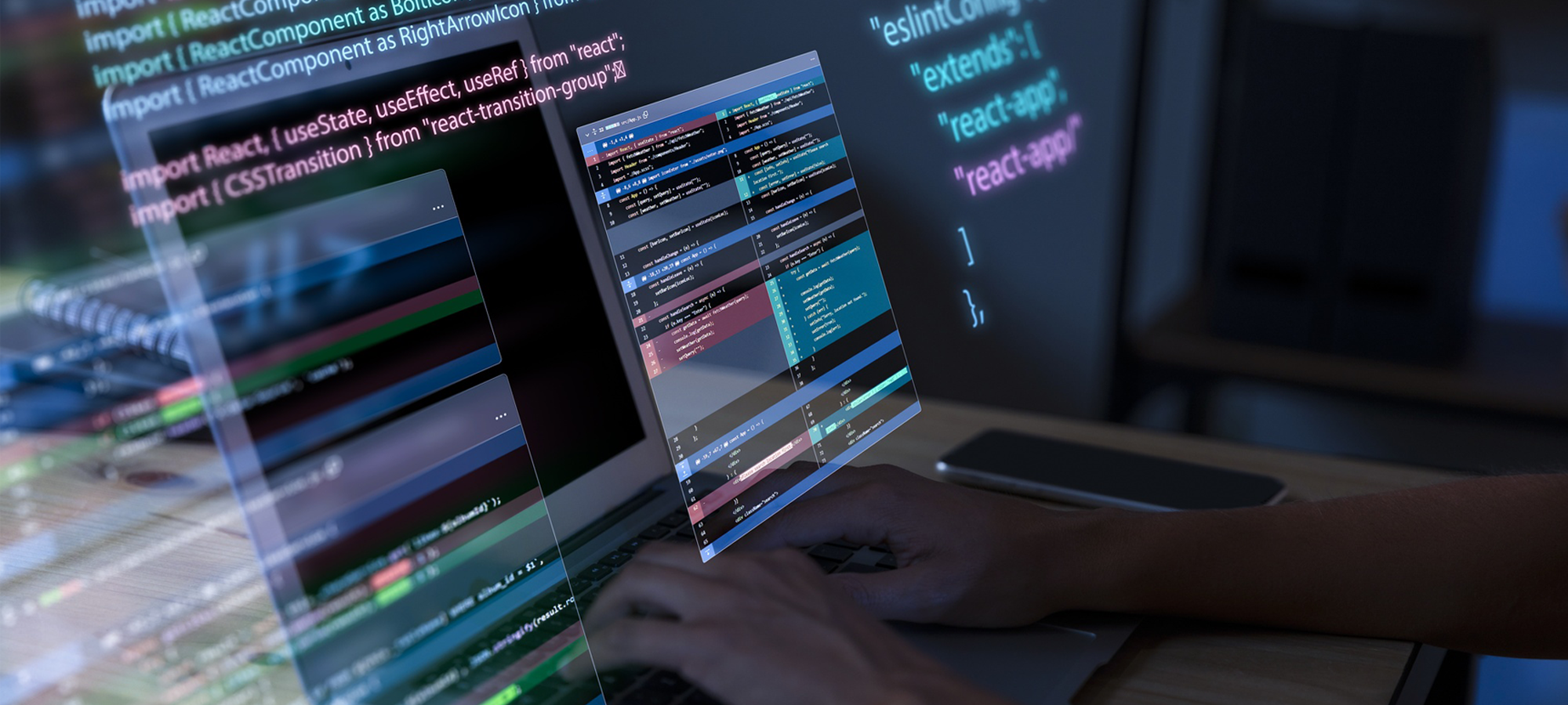 Developer working on code with multiple monitors